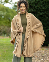 woman outside wearing volant ruffle cashmere cape in camel