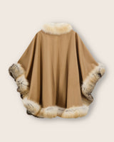 Back of Cervinia fur trimmed cape in golden Island