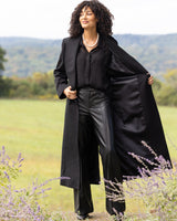 model wearing Cashmere Belted Shawl Collar Long Coat with Pick Stitching in black