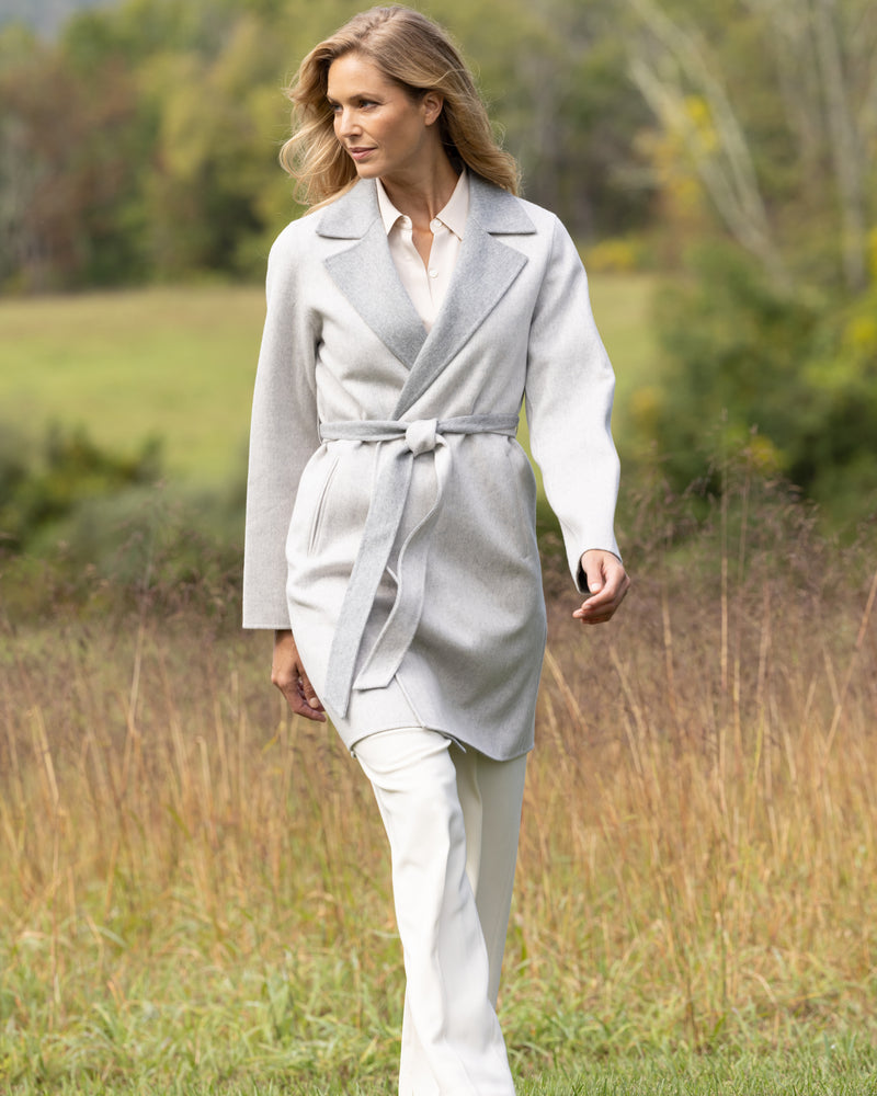 woman walking in field and wearing Cashmere Bella Coat in grey 