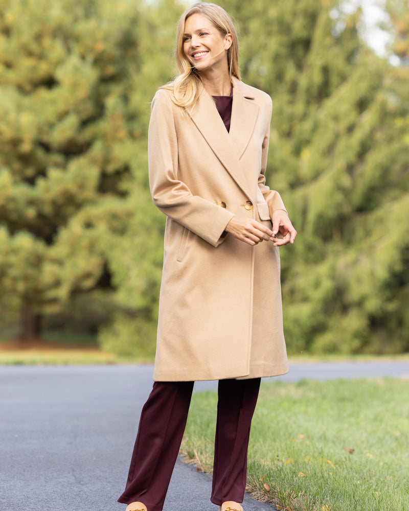 Woman outside smiling and Wearing Pure Cashmere Pick-Stitched Double-Breasted Coat In Camel