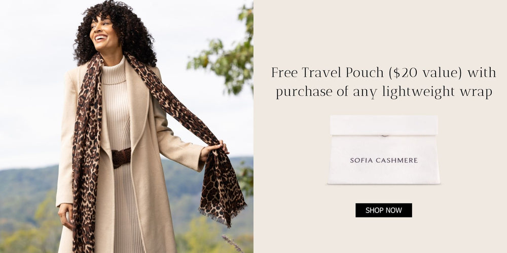 Photo of woman in leopard print wrap and cashmere coat copy reads; Free travel bag ($20 value) with purchase of any lightweight wrap.