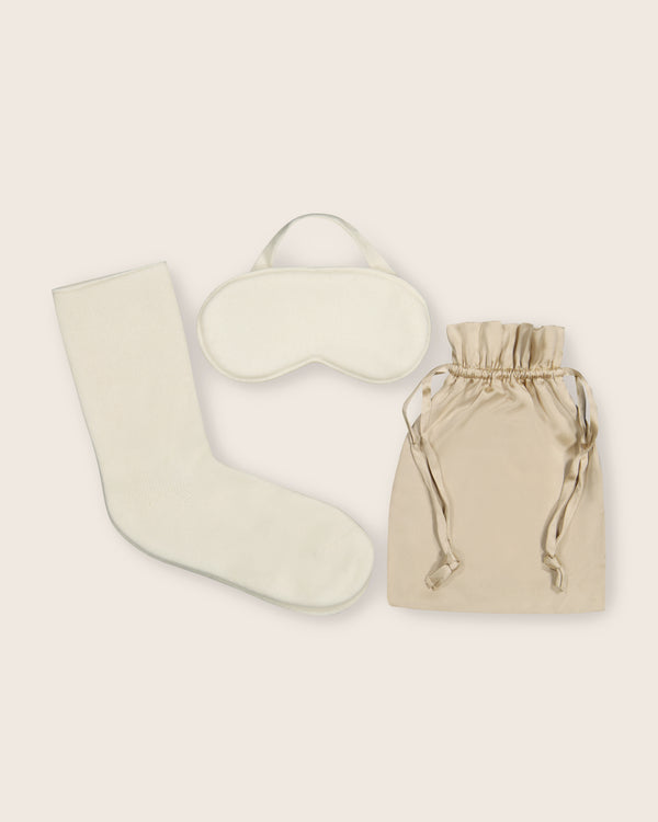 Capri Cashmere Travel Set in ivory; flat images of socks, eye sleep mask and silk pouch