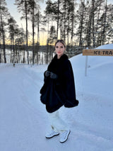 model wearing cervinia in black on snowy hill