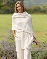 Model wearing Voyage Cashmere Travel Wrap in ivory