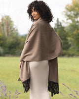 Model wearing Cashmere Wrap with Leather Fringe in Heather Taupe