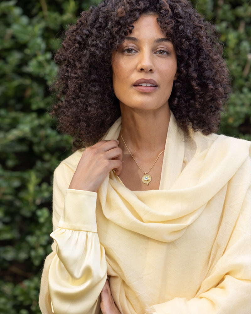 model wearing st tropez lightweight cashmere wrap in butter