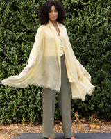 model wearing st tropez lightweight cashmere wrap in butter