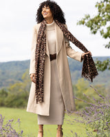 Woman wearing Lightweight cashmere wrap in  camel leopard