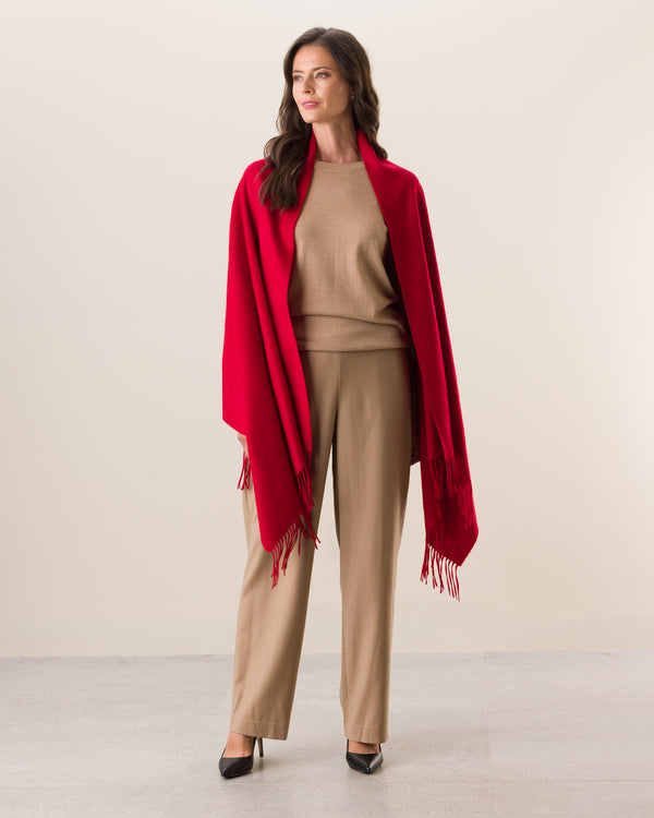 Woman wearing Cashmere water weave wrap with fringe in red