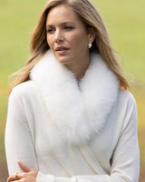 Woman wearing Wrap sweater with fur collar in Ivory